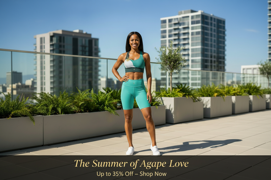 Woman in teal biker shorts and sports bra on a rooftop — The Summer of Agape Love Sale, up to 35% off at Eternal Agape
